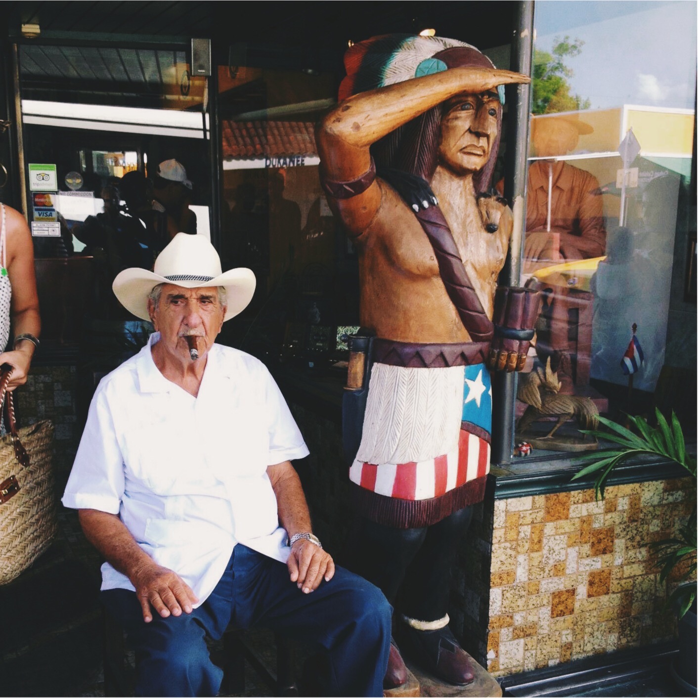 Old man smoking a cigar in Little Havana, Miami